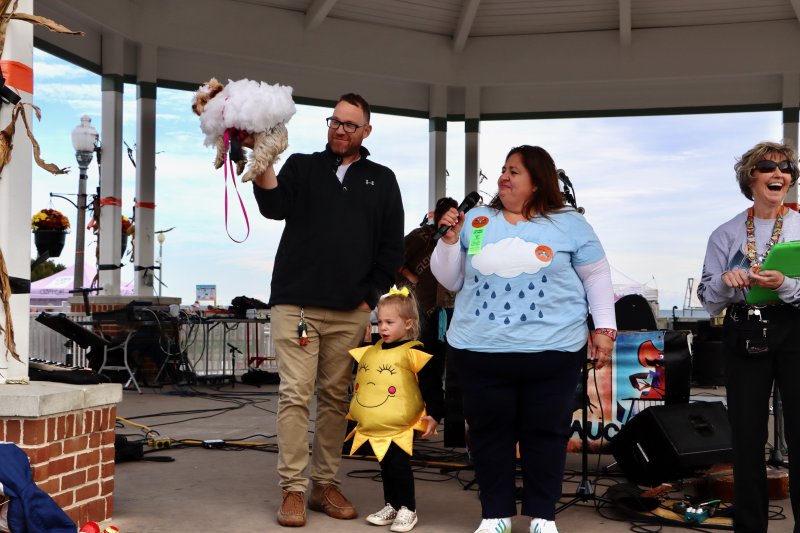 The Fake family of Reading, Pa., dressed as The Weather Channel. Their little pooch, Velma, played the role of the cloud. They won an award for their creative costume.